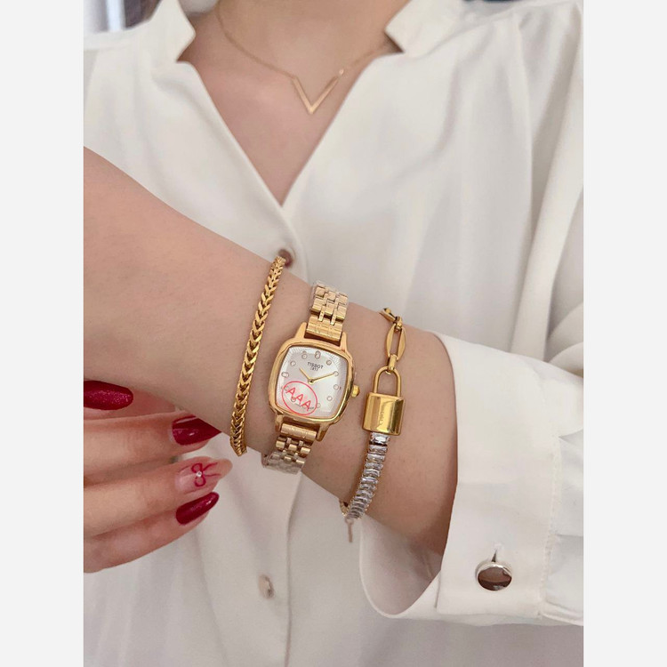 ساعت مچی زنانه تیسوت TISSOT بند استیل طلایی صفحه طلایی ضدآب شیک وجذاب
