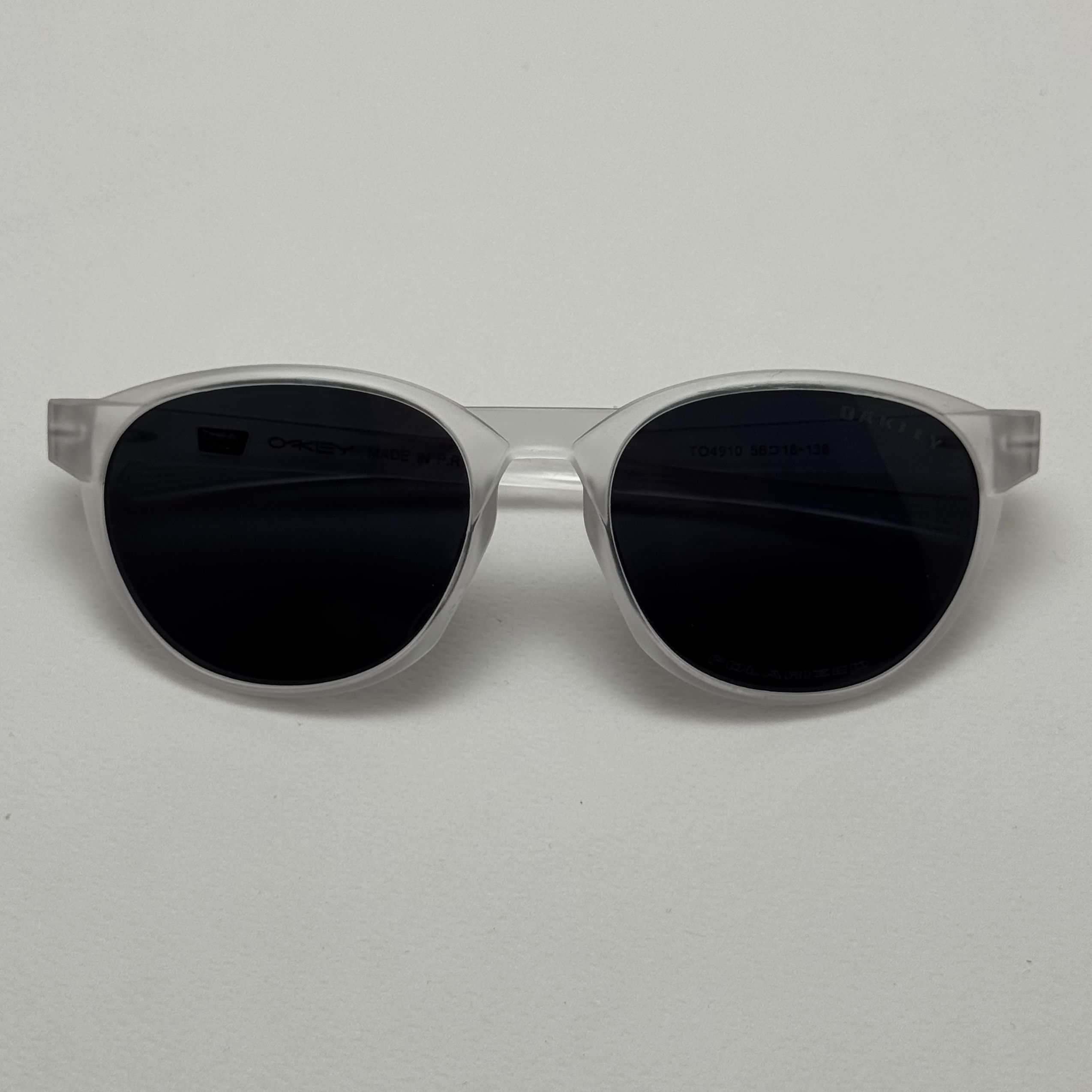 عینک آفتابی پلاریزه اوکلی Oakley فریم کریستالی عدسی مشکی گرد کد TO4910