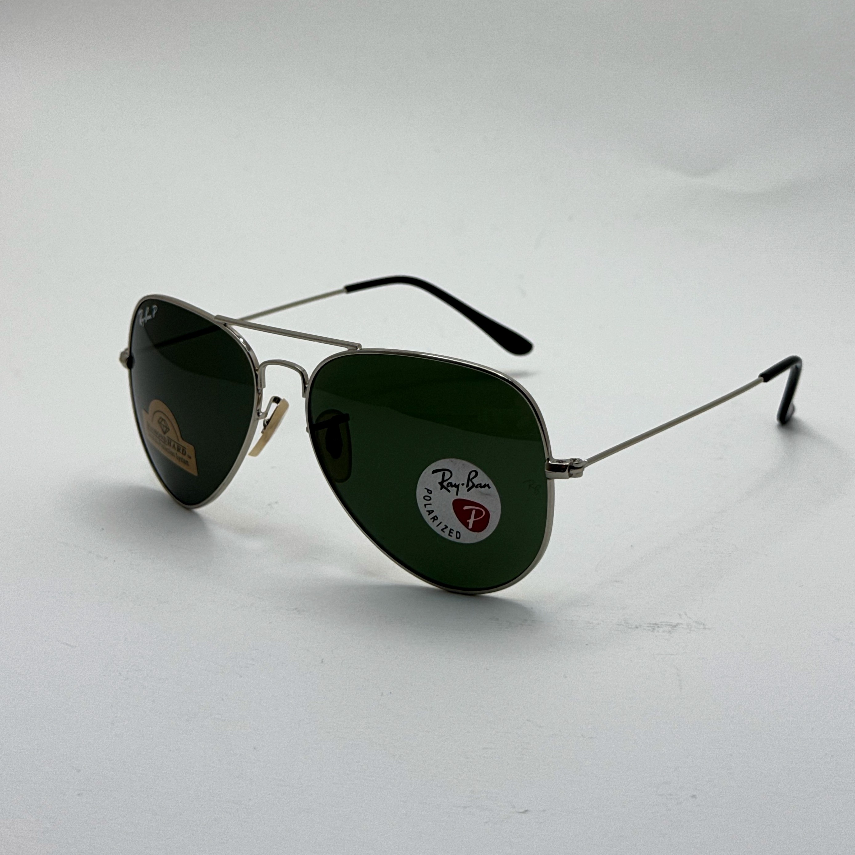 عینک ریبن خلبانی شیشه سنگ پلاریزه سبز با فریم نقره ای به همراه پک کامل ریبن کد Rayban RB 3026