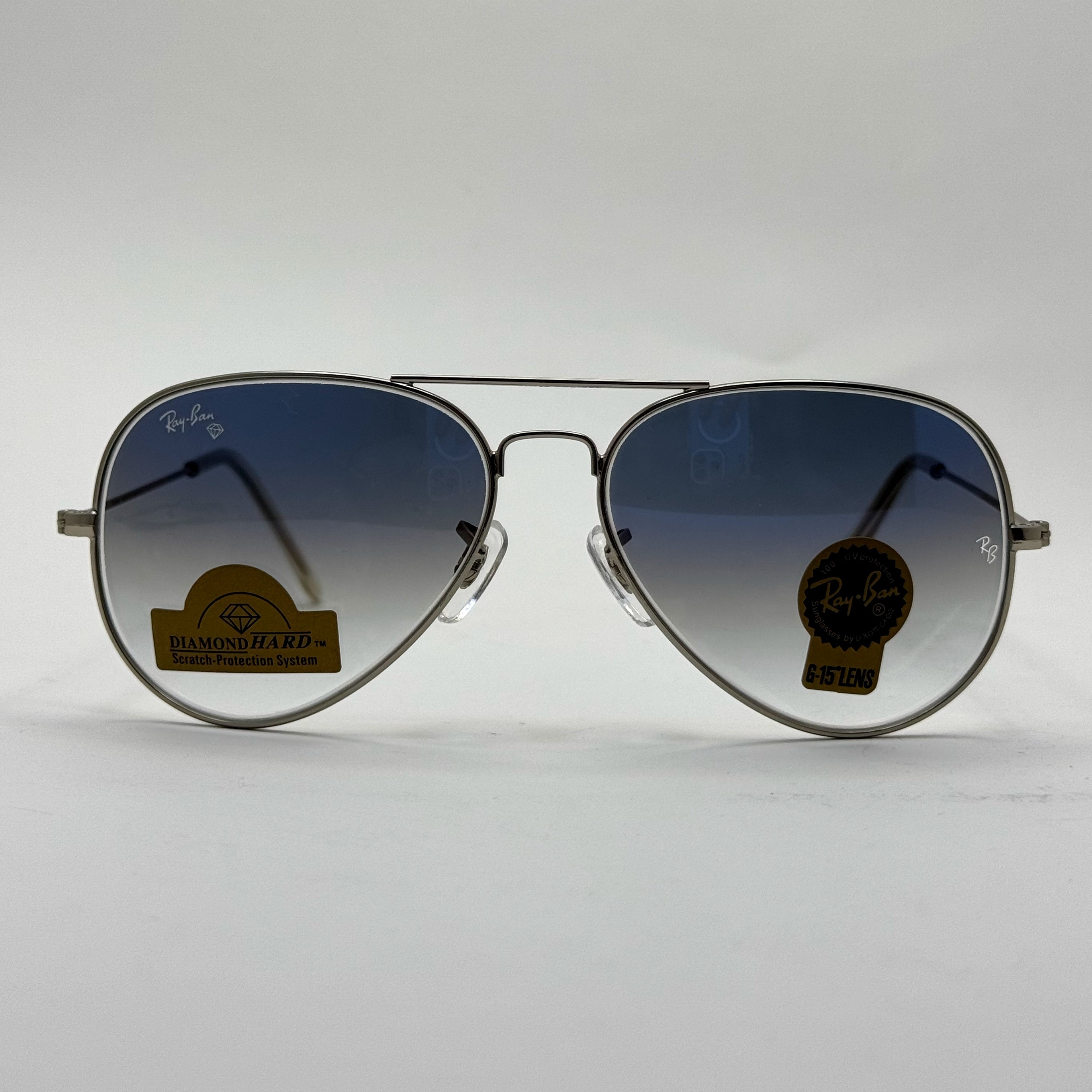 عینک ریبن خلبانی شیشه سنگ آبی هایلایت فریم نقره ای به همراه پک کامل ریبن Rayban RB 3025