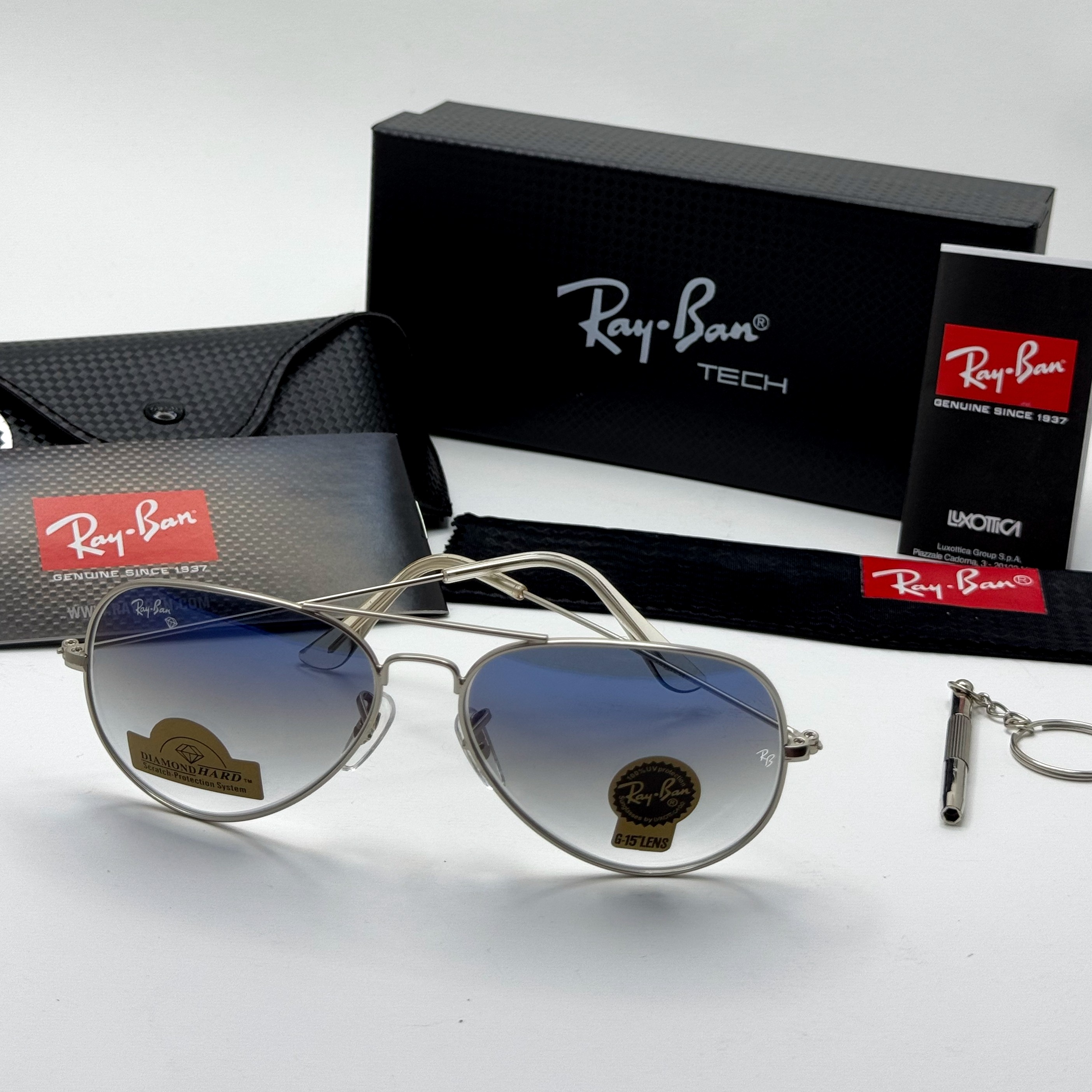 عینک ریبن خلبانی شیشه سنگ آبی هایلایت فریم نقره ای به همراه پک کامل ریبن Rayban RB 3025