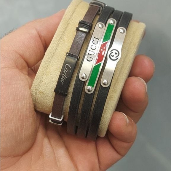 دستبند چرمی قفل و پلاک استیل مردانه طرح رولکس Rolex کیفیت چرم عالی تنوع طرح رنگ ثابت کد bn (پس کرایه)