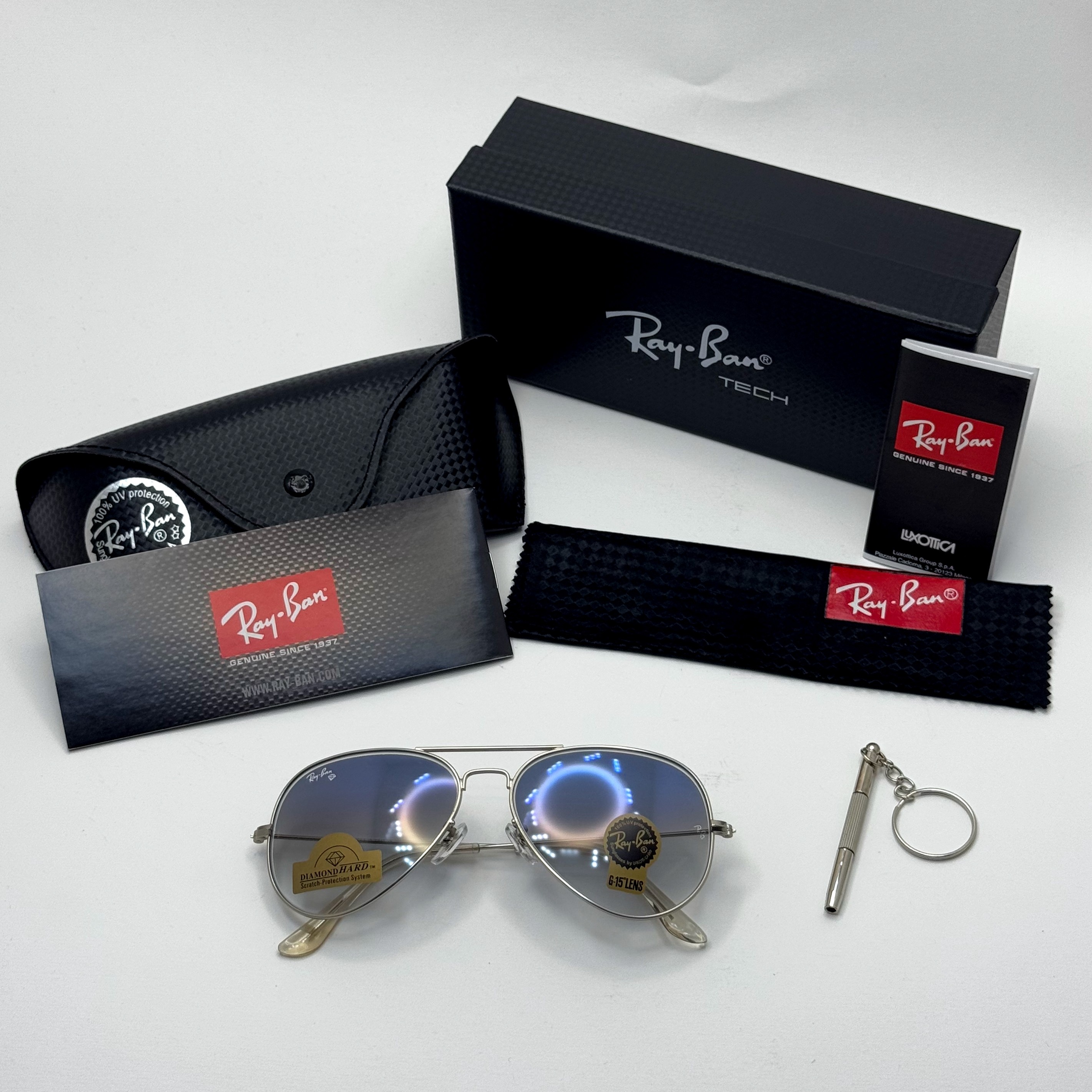 عینک ریبن خلبانی شیشه سنگ آبی هایلایت فریم نقره ای به همراه پک کامل ریبن Rayban RB 3025 (ارسال رایگان)